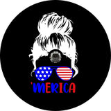 Silhouette of a girls head with a messy bun wearing sunglasses that are patriotic colors red, white and blue like the American flag and the word 'merica underneath in blue and red spare tire cover design for a black vinyl spare tire cover for Jeep, Bronco, RV, Camper, and more. Design is made for a tire cover in need of a back up camera