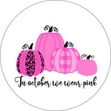 Four pink pumpkins designed with the saying in October we wear pink spare tire cover on white vinyl for Jeep, RV, Camper, Bronco and more