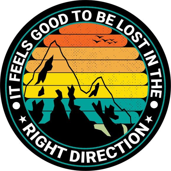 Creative spare tire cover multi-colored layered background with a mountain silhouette and the saying it feels good to be lost in the right direction