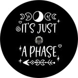 It's just a phase quote with moon and arrow design accents spare tire cover for Jeep, RV, Camper, and more on black vinyl with back up camera design.