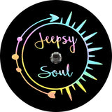 Jeepsy soul written inside a pastel tie dye sun and arrow spare tire cover design for Jeep with JL backup camera