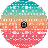 Turquoise, orange, and red ombre colored creative spare tire cover with arrow and Aztec or southwestern printed pattern.  Unique spare tire cover design for a wheel cover on a Bronco, Jeep, RV, camper, and more with a hole for a back up camera.