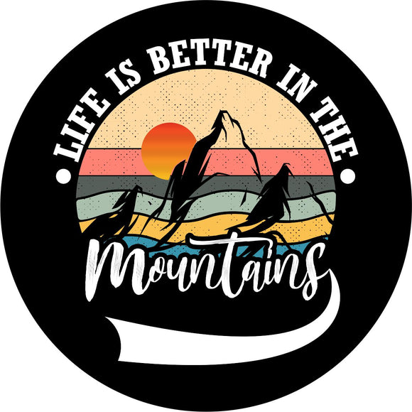 Creative and colorful spare tire cover on black marine-grade vinyl of mountain silhouette and a sunset with the saying, 