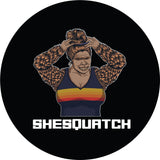 Shesquatch putting her hair in a top knot messy bun black vinyl custom spare tire cover 