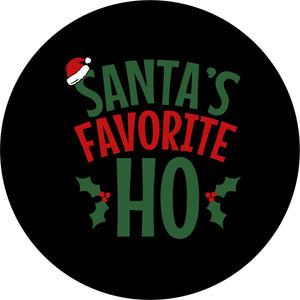 Black vinyl funny spare tire cover design in green and red letters saying Santa's Favorite Ho, with a Santa hat and holly berries Christmas theme design.